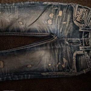 The rock revival jeans are like brand new they have no holes no rips no damage